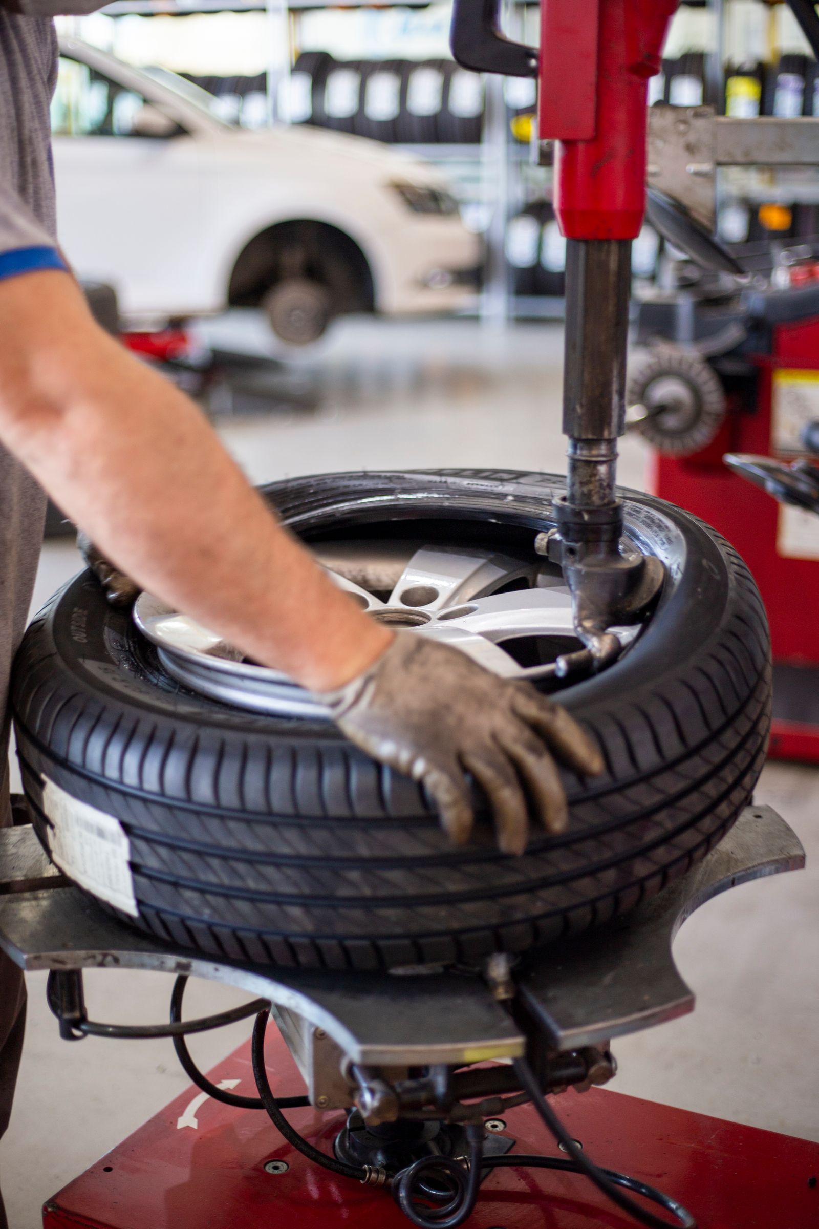 Tire being mounted onto a rim with a tire changer machine