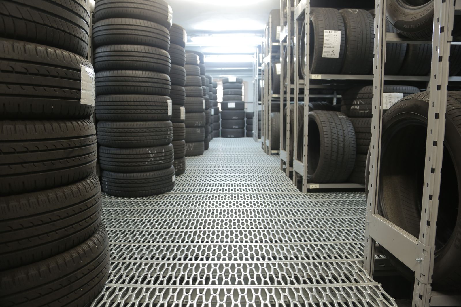 Aisle of stacked tires in the stockroom